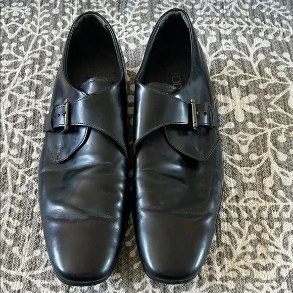 Tod’s black buckle loafers